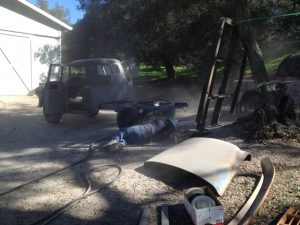 Sandblasting the underside of the 1956 Chevrolet truck frame