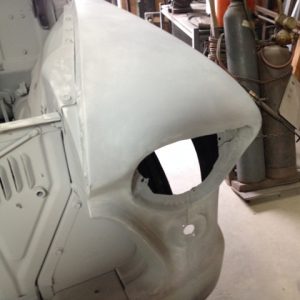 1956 Chevy truck fender repair after primer applied.