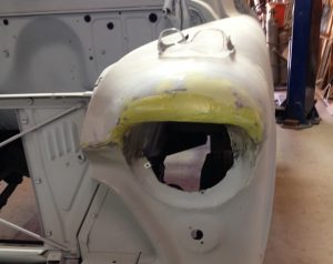 1956 Chevy truck fender with body filler applied.