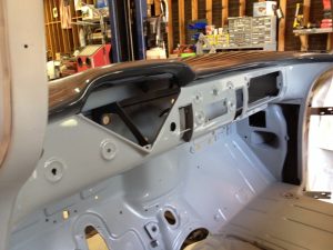 Interior of 1956 Chevy truck painted in shades of gray.