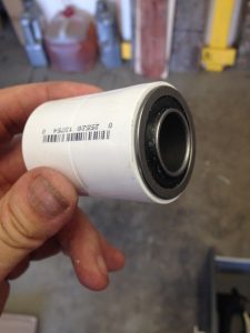 Flanged bearing inserted into PVC coupler