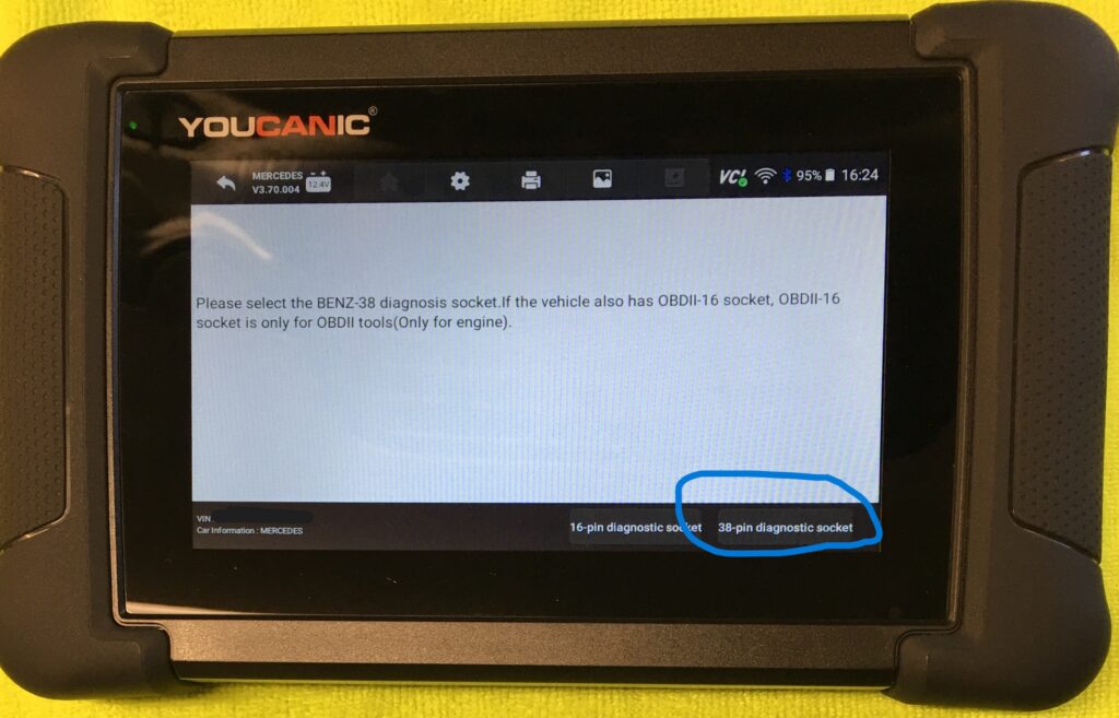Diagnostic scanner screen showing options for BENZ-38 and 16-pin diagnostic sockets for vehicle module scanning.